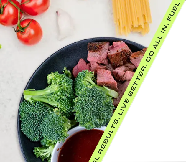 Healthy meal with broccoli, steak, and fresh vegetables